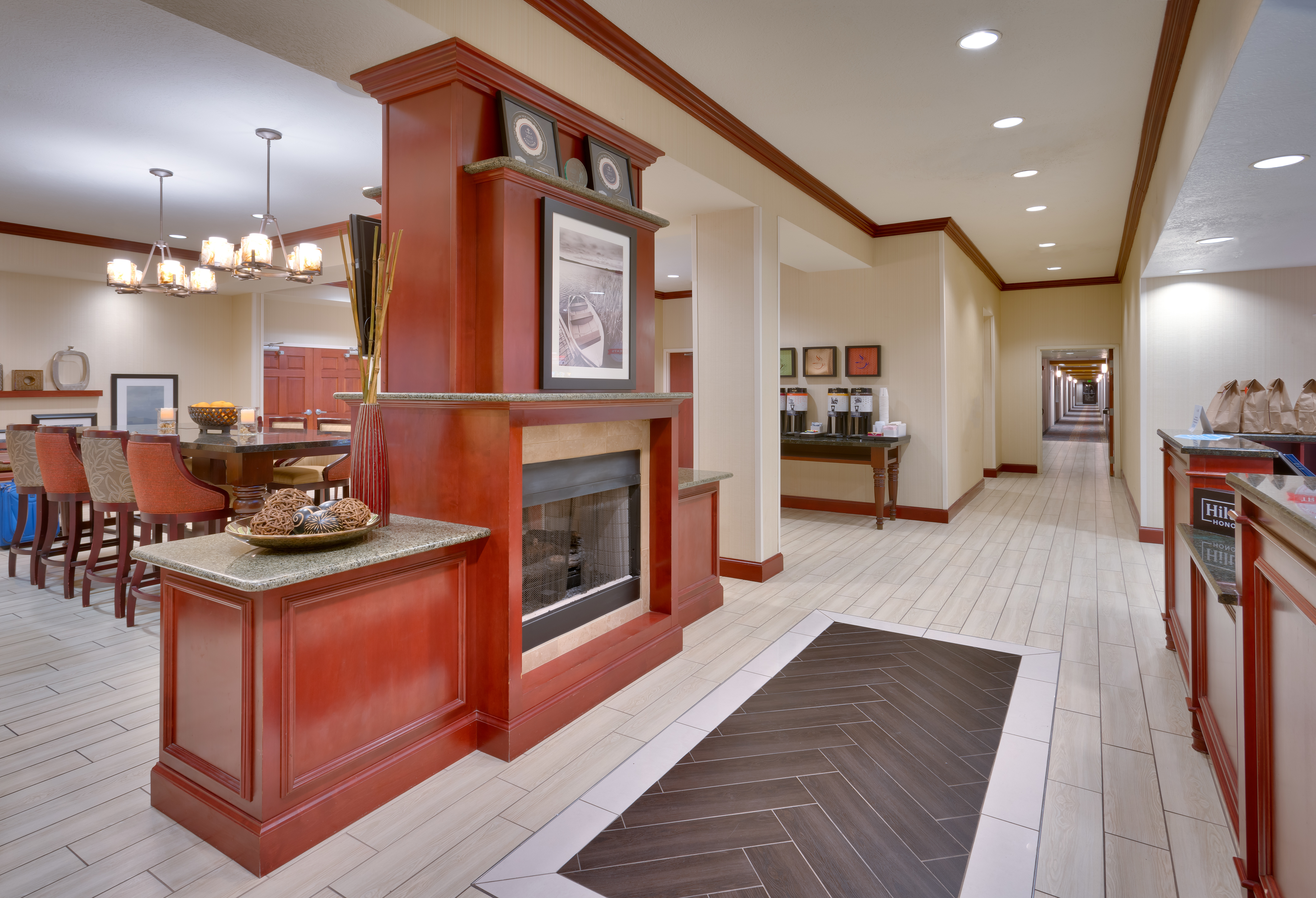Fireplace, Hot Beverage Station, and Breakfast Dining Area in Lobby