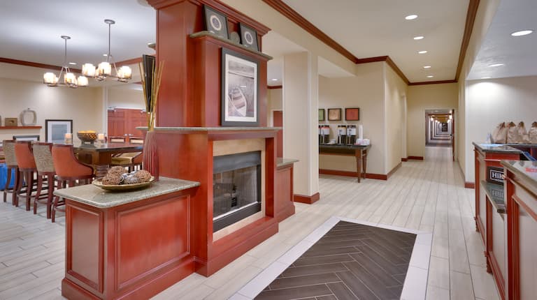 Fireplace, Hot Beverage Station, and Breakfast Dining Area in Lobby