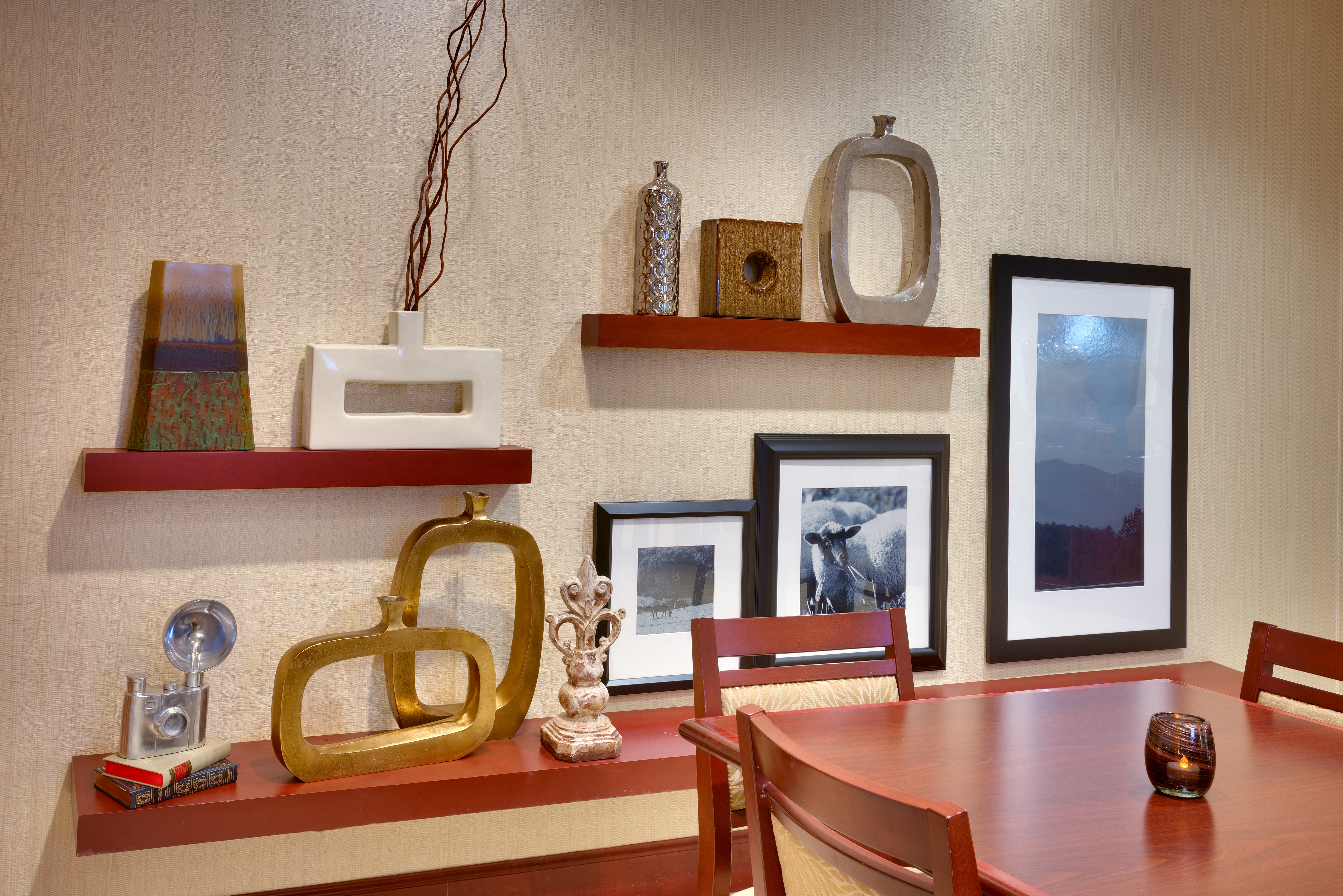 Dining Table, Chairs, and Art on Display in Lobby Breakfast Area