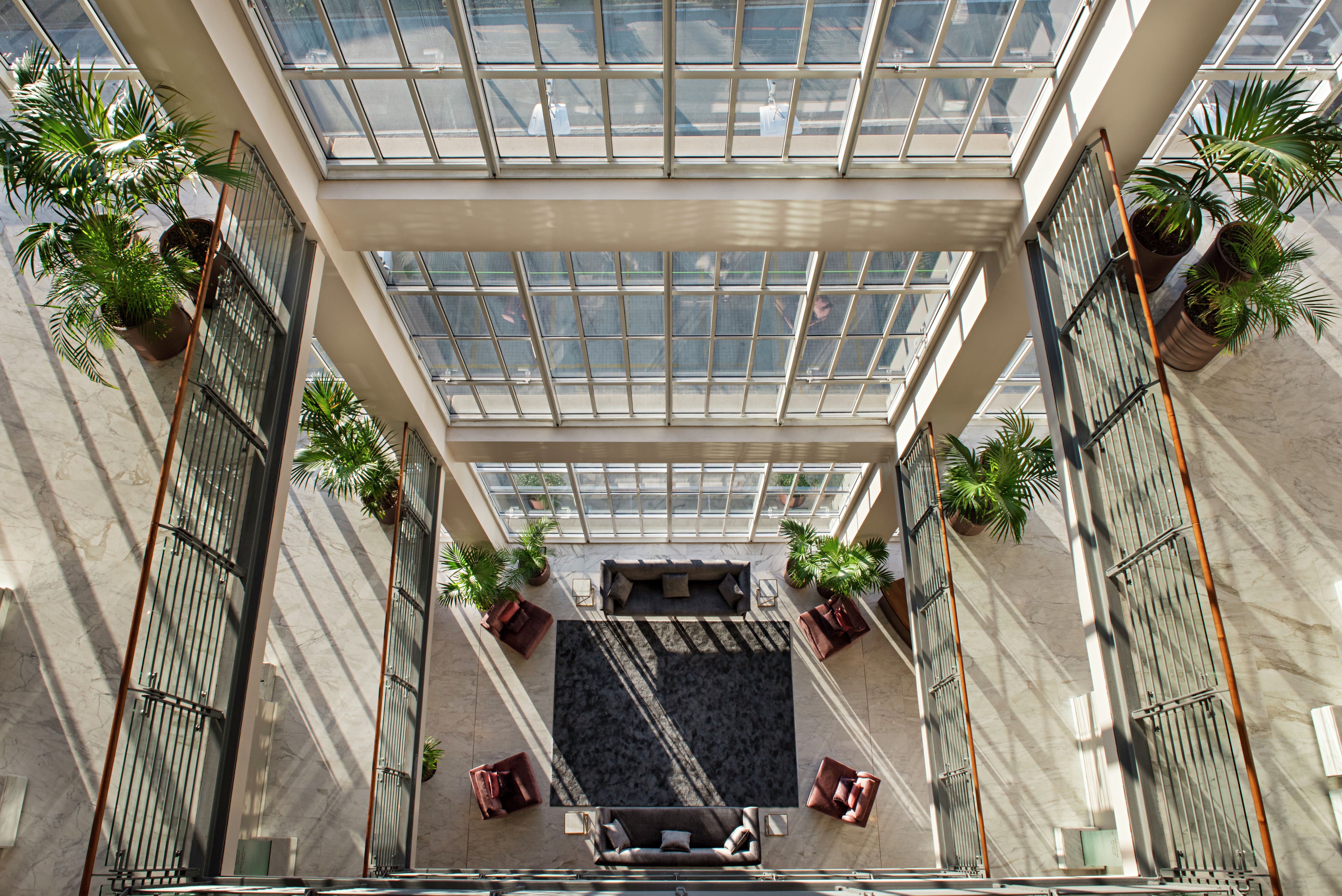 Overhead View of Lobby Seating in Atrium with Terrance and Floor to Ceiling Windows