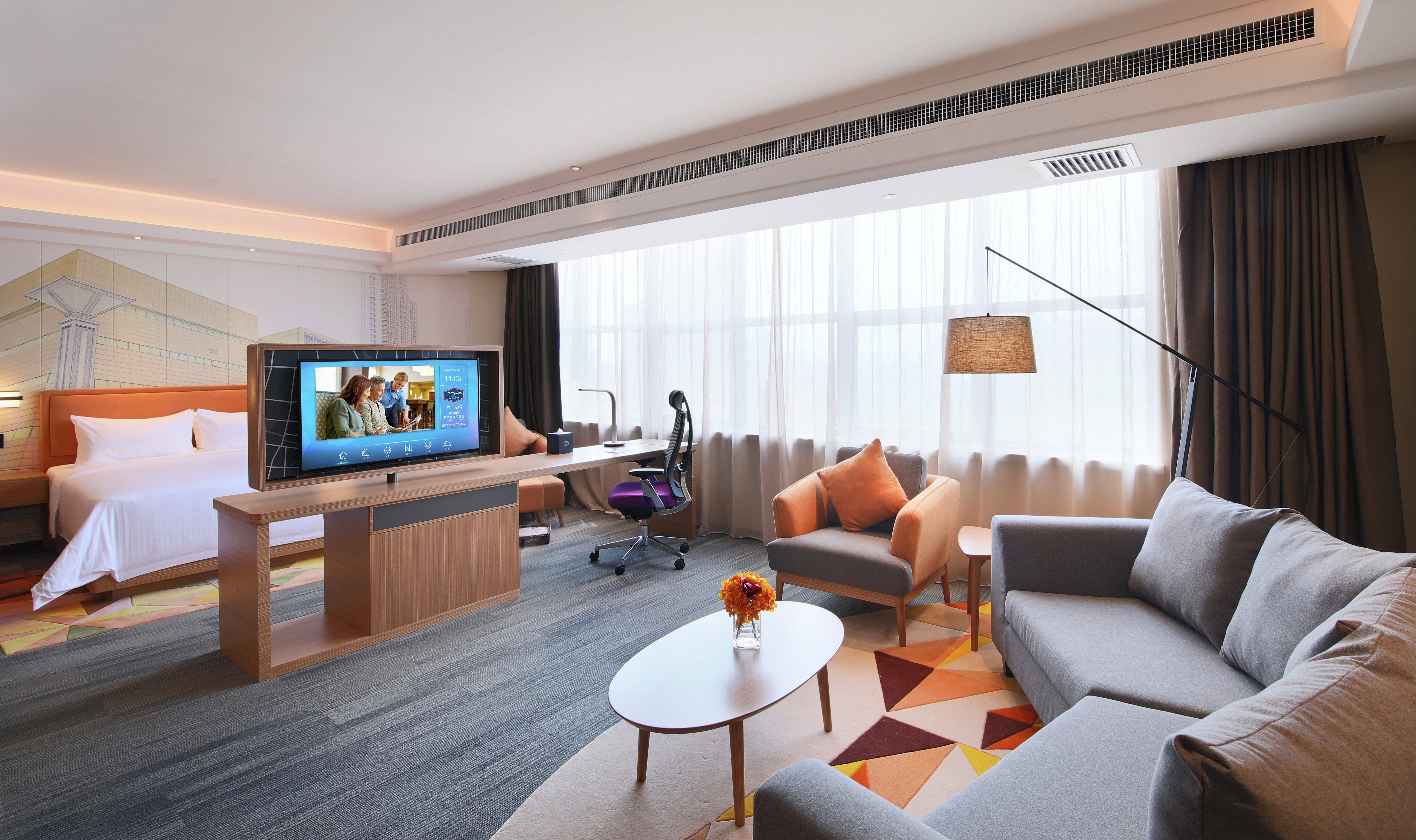 King Bed, Lounge Area, Work Desk with Ergonomic Chair, and Flat Screen TV in Suite