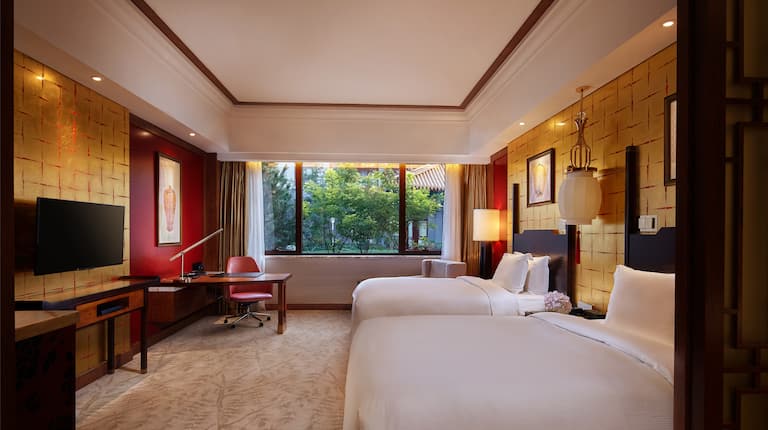 Twin-Sized Beds and Desk in Deluxe Room   