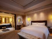 King-Sized Bed and Large Bathroom in Presidential Suite   