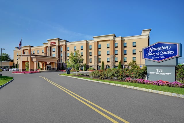 exterior view of hotel and signage in the day