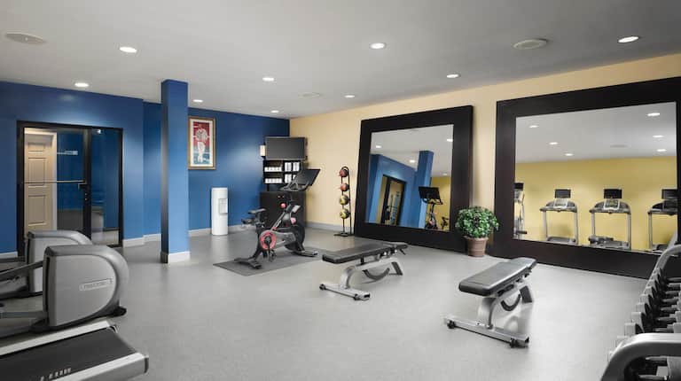 on site fitness center, peloton bike, weight benches, free weights
