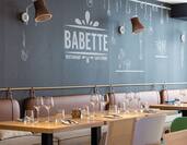 Logo and Dining Area at Babette Restaurant