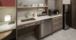 Guestroom Kitchen Area with Counter, Dishwasher, Microwave and Refridgerator