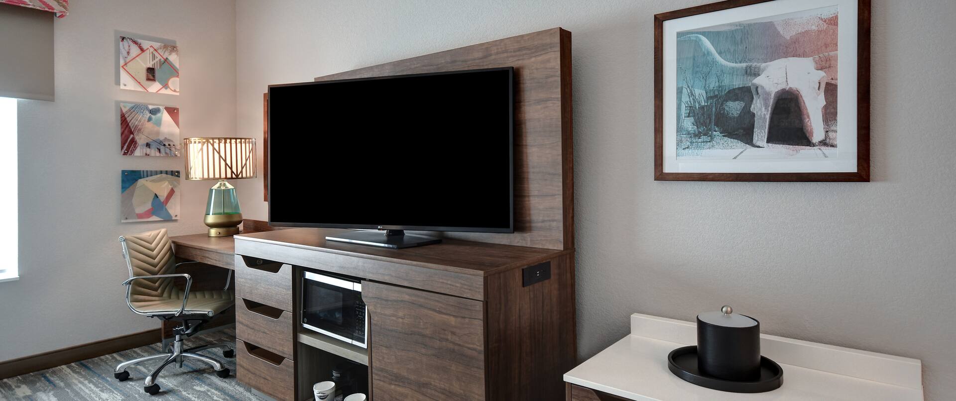 guest room with television and work desk