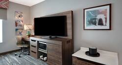 guest room with television and work desk
