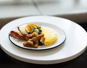 breakfast plate, omelet, potatoes, bacon