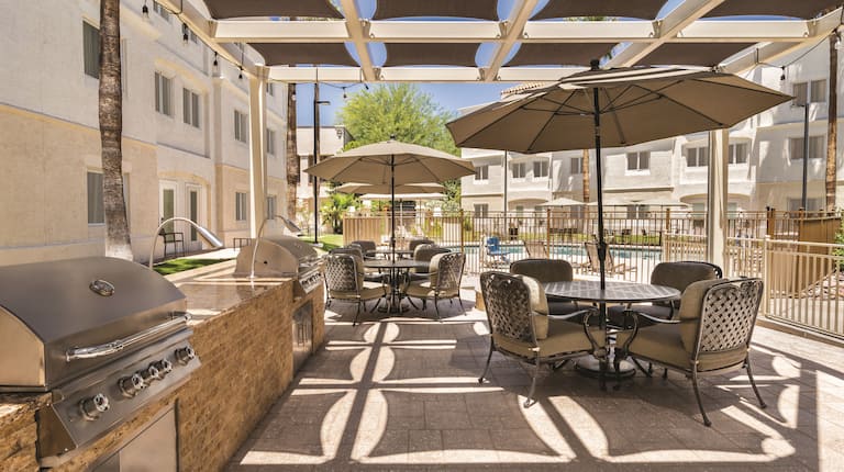 Outdoor patio area with grills