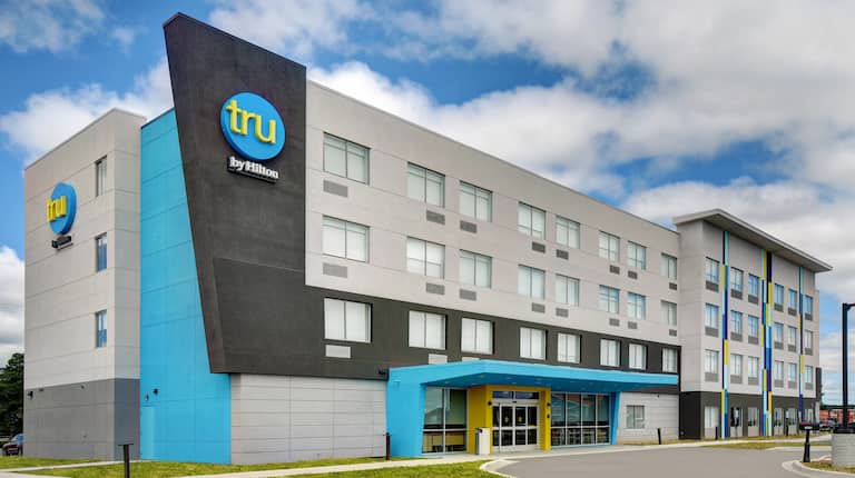 exterior front of hotel in the day