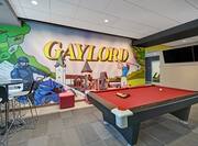 lobby gaming area with mural and pool table
