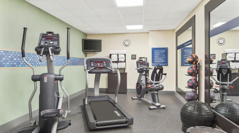 Fitness Center with Treadmill, Elliptical Machine, and Medicine Balls