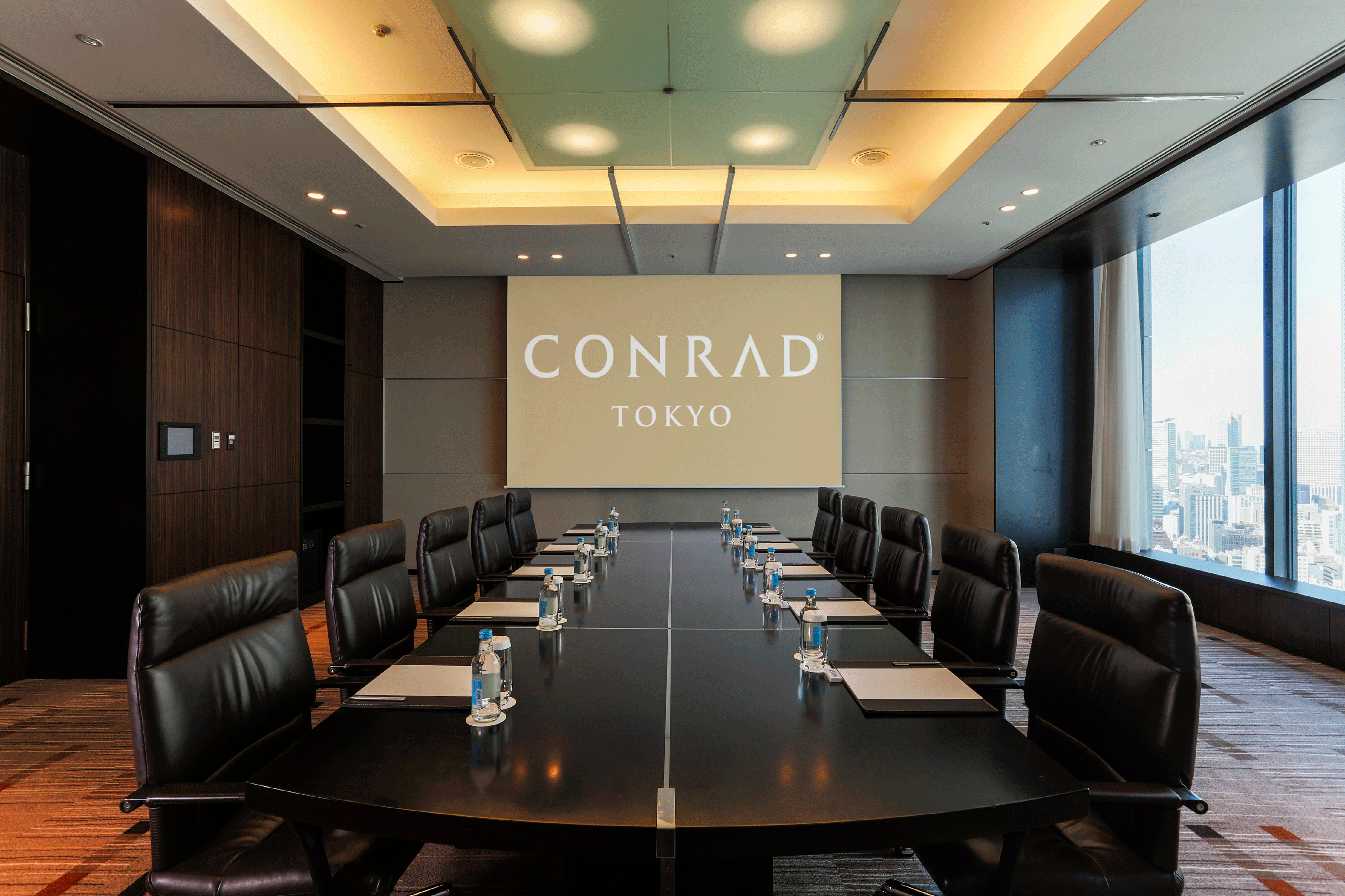 Meeting Room in boardroom setup with Projector Screen