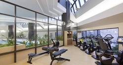 Fitness Center with Weight Bench, Rowing Machine and Cycle Machines