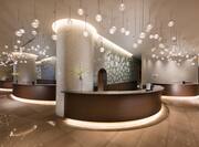 Brightly Lit Reception Area With Semicircular Desk