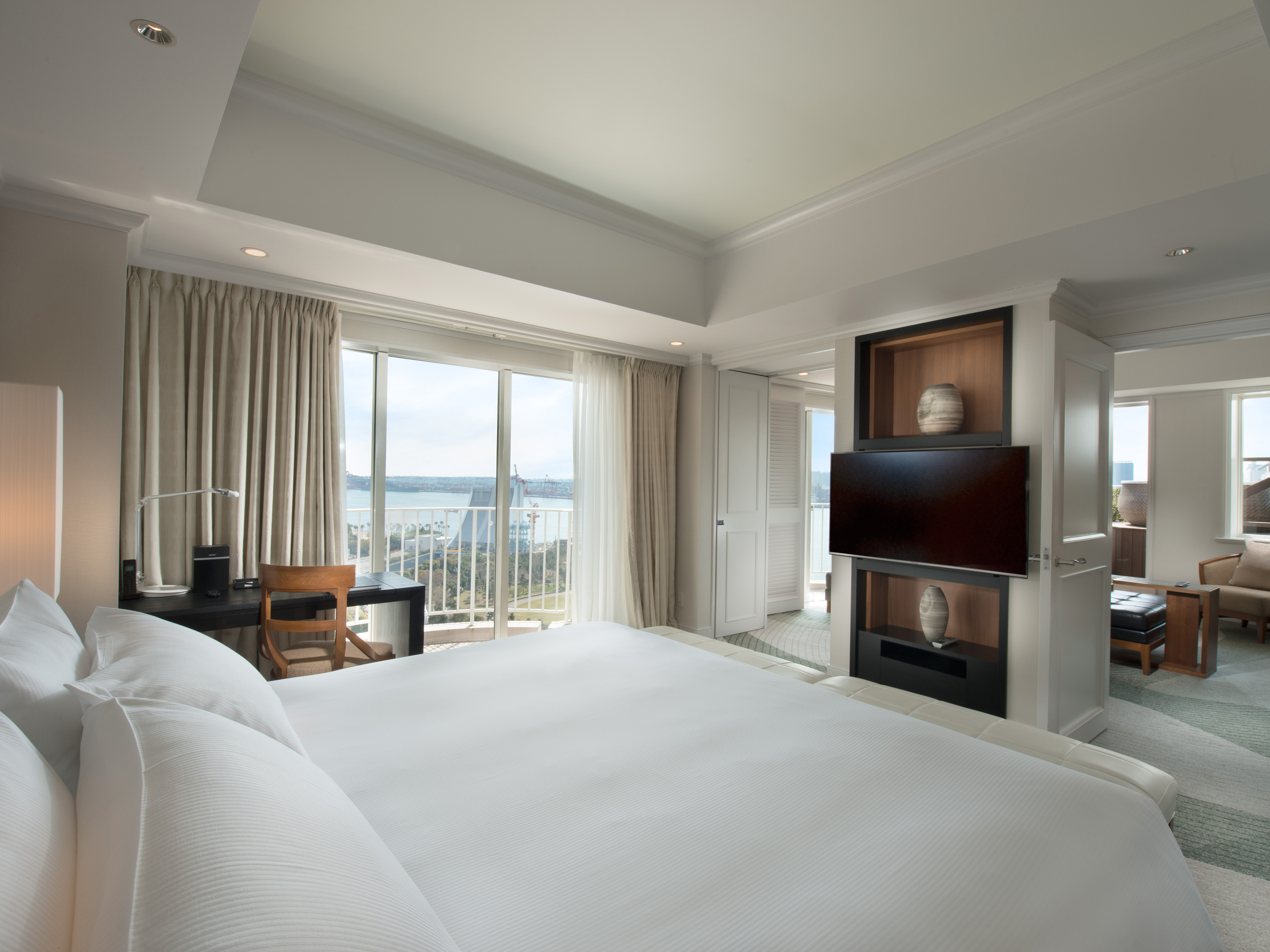 King Terrace Suite Bed View with TV and view of other room