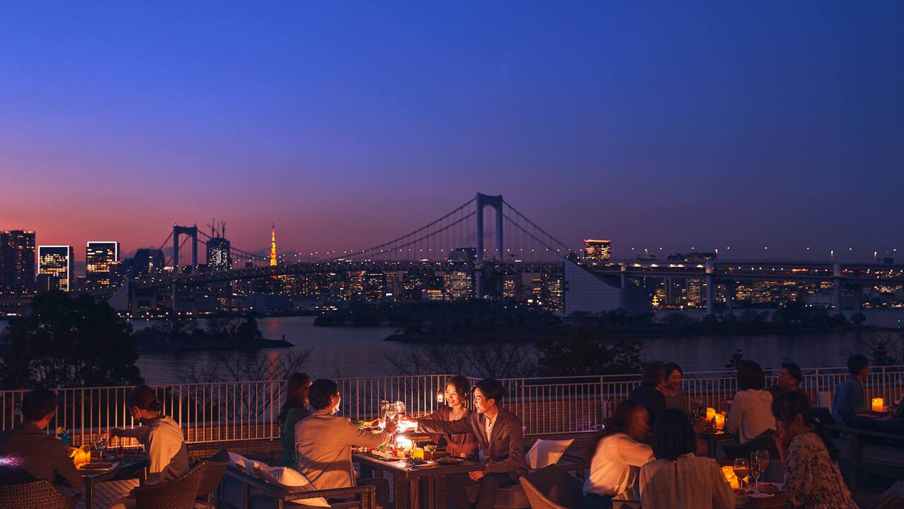 people sitting outside on chairs