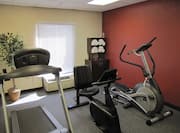  Fitness Center With Elliptical, Treadmill, Bike, and Towel Station