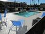 Outdoor Swimming Pool With Loungers, Chairs and Tables