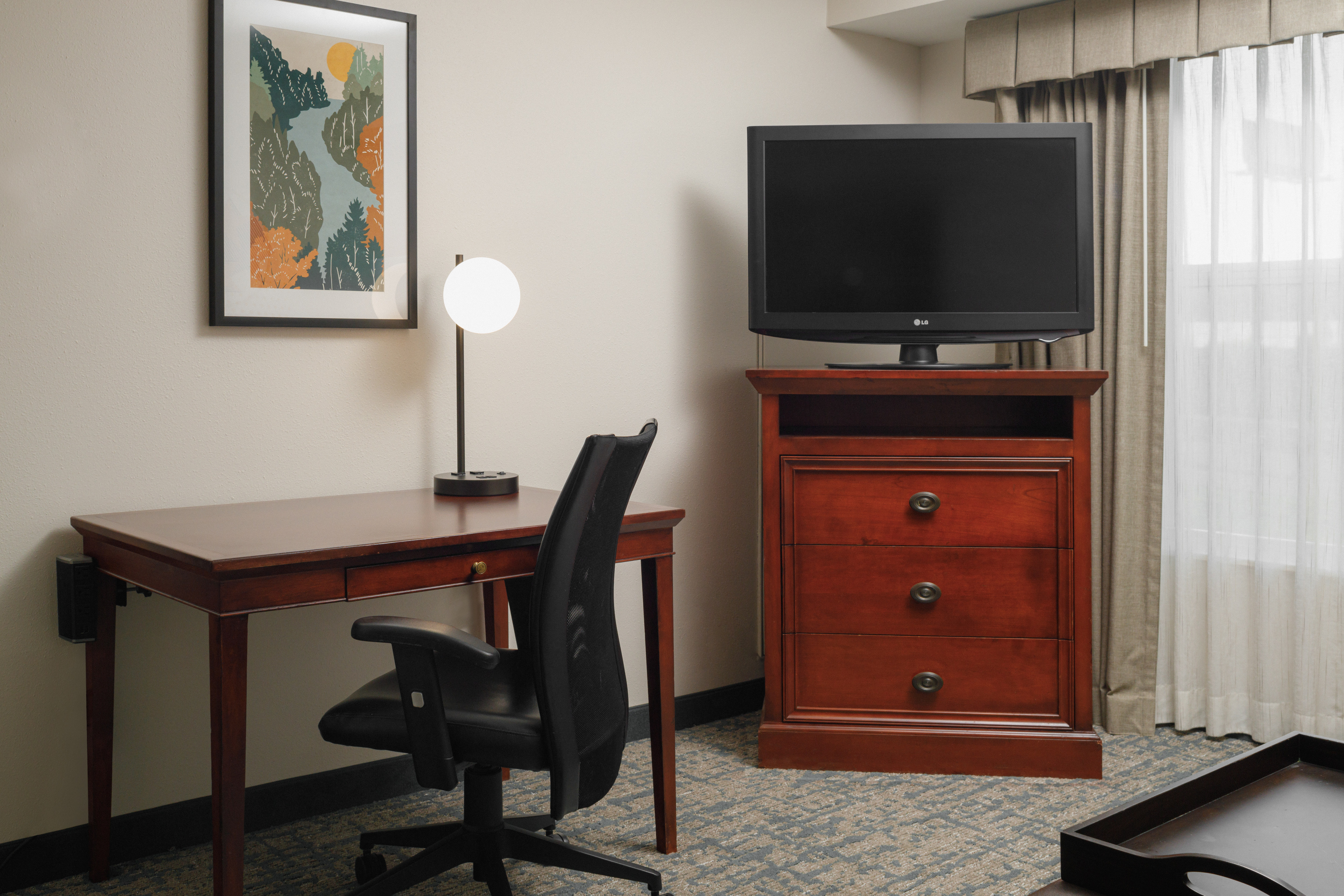 Desk and HDTV in a Guest Room