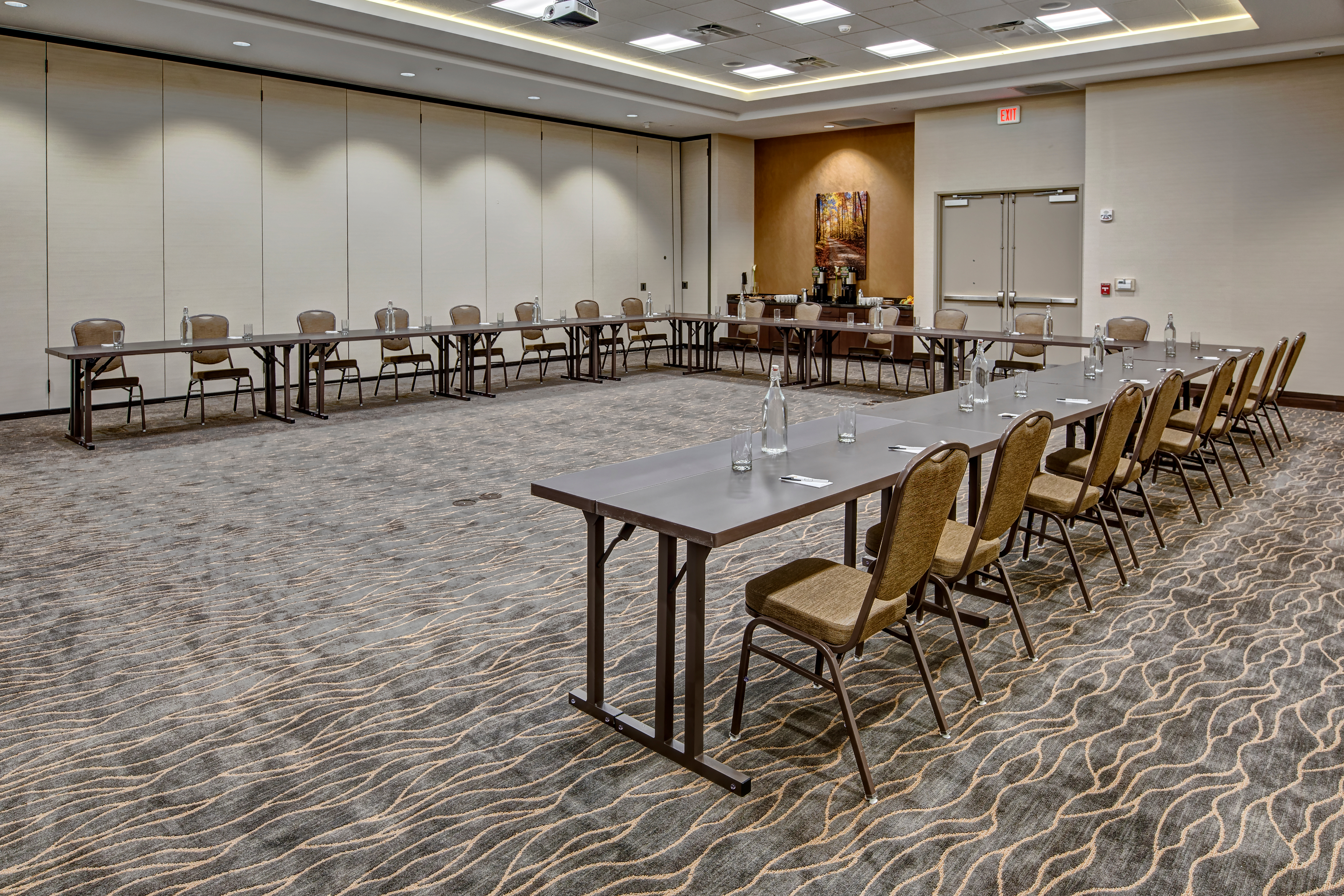 Meeting Room With U-Shaped Table, Chairs, and Refreshments Table