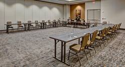 Meeting Room With U-Shaped Table, Chairs, and Refreshments Table