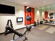 Fitness room with equipment and mirrors