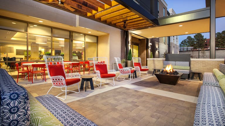Outdoor Patio Seating Area with Firepit at Night