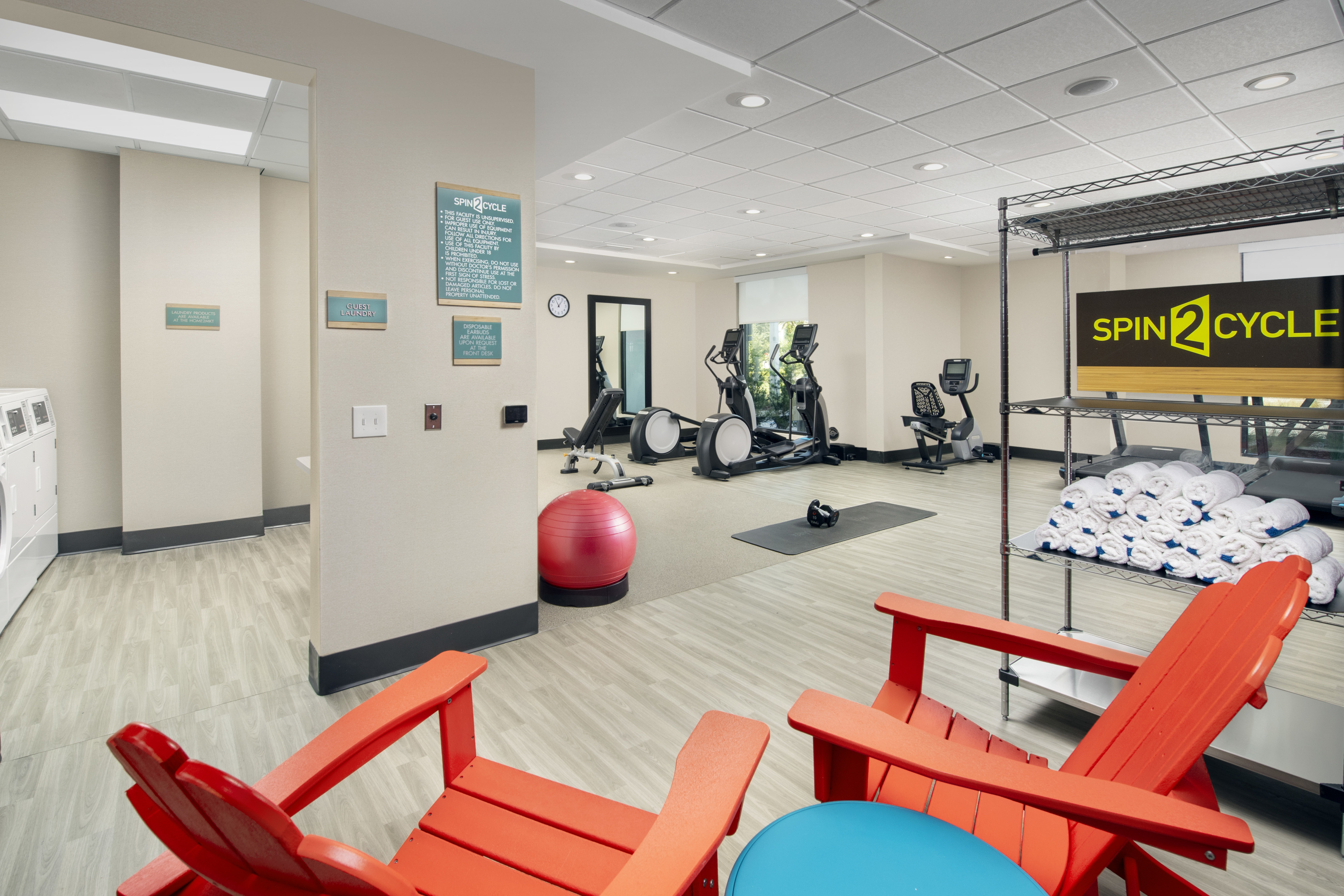 Fitness center with cardio machines and towels