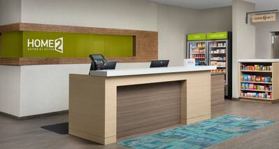 Front desk area with fridge and snacks