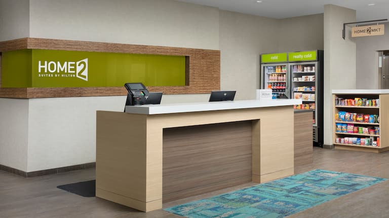 Front desk area with fridge and snacks