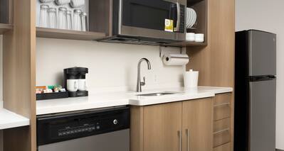 Kitchen area with microwave and sink
