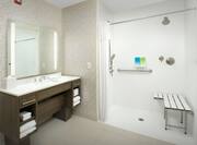 Bathroom with roll-in shower and sink