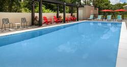 Outdoor pool with loungers
