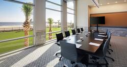 Conference Table, Chairs, and Monitor in Surf Crest Boardroom with Ocean View