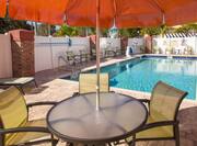 Outdoor Table with Umbrella Poolside