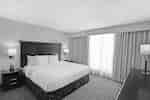 King suite with bed, nightstands, and lamps
