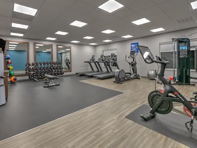 Treadmills, Weights and Exercise Bikes in Fitness Center with HDTV