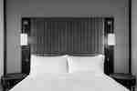 Detail of Bed and Two Lamps in a Guest Room