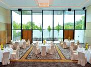 Meeting Room with Banquet Tables and Floor to Ceiling Windows