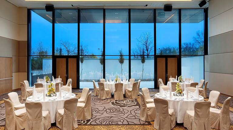 Banquet Tables in Meeting Room with Large Windows