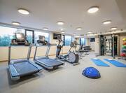 Fitness Center with Treadmills and Yoga Mats
