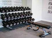 Fitness center with free weights and bench