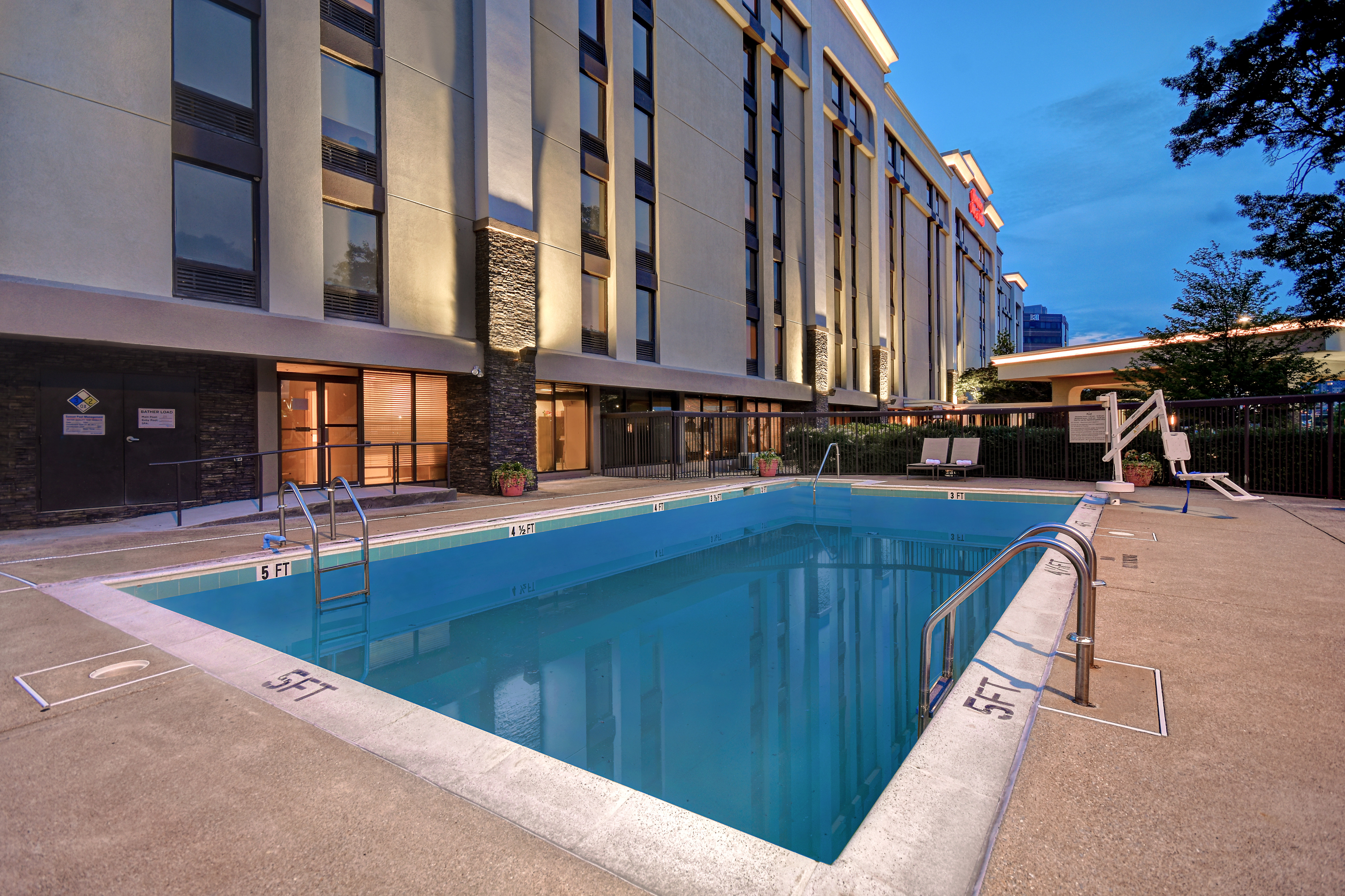 Outdoor Pool Area and View of Hotel Exterior