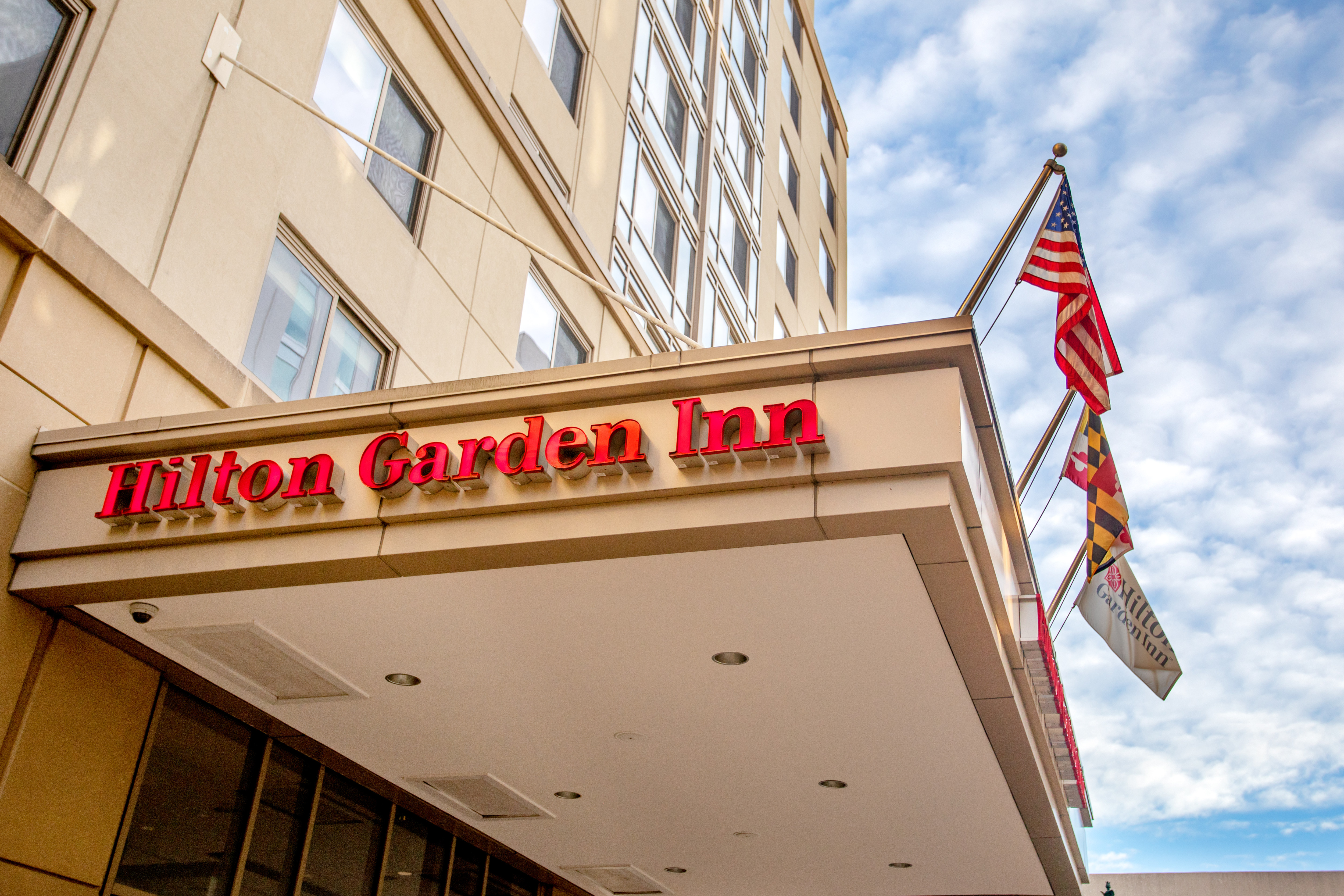 Hilton Garden Inn Hotel Exterior with Flags
