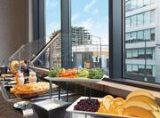 Wine, Cheese, Vegetable and Fruit Selections by Window at Evening SocialHealthy Options like Fresh Fruit, Yogurt and Granola at our Complimentary Breakfast Buffet