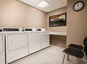 Guest Laundry with Coin Operated Washing and Drying Machines, Folding Table and ChairsOnsite Laundry Services