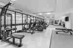 Treadmills, Elliptical Machines and Strength Equipment in a Fitness Center with HDTVs